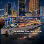 Elderly travellers enjoying a Dubai New Year cruise with fireworks views.