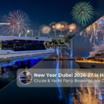 New Year Dubai 2026-27 yacht cruise with fireworks and city skyline.