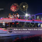 Children enjoying a festive New Year's Eve cruise in Dubai with family.