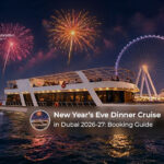 Guests enjoying a festive dinner cruise with Dubai skyline views on New Year’s Eve.